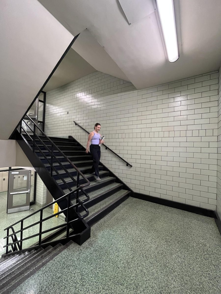 Please don’t fall. Sophomore Ryann Lee walking down the stairs in the hottest part of the school, Shannon Building. “Passing periods feel like a hot, crowded sauna,” Lee said.