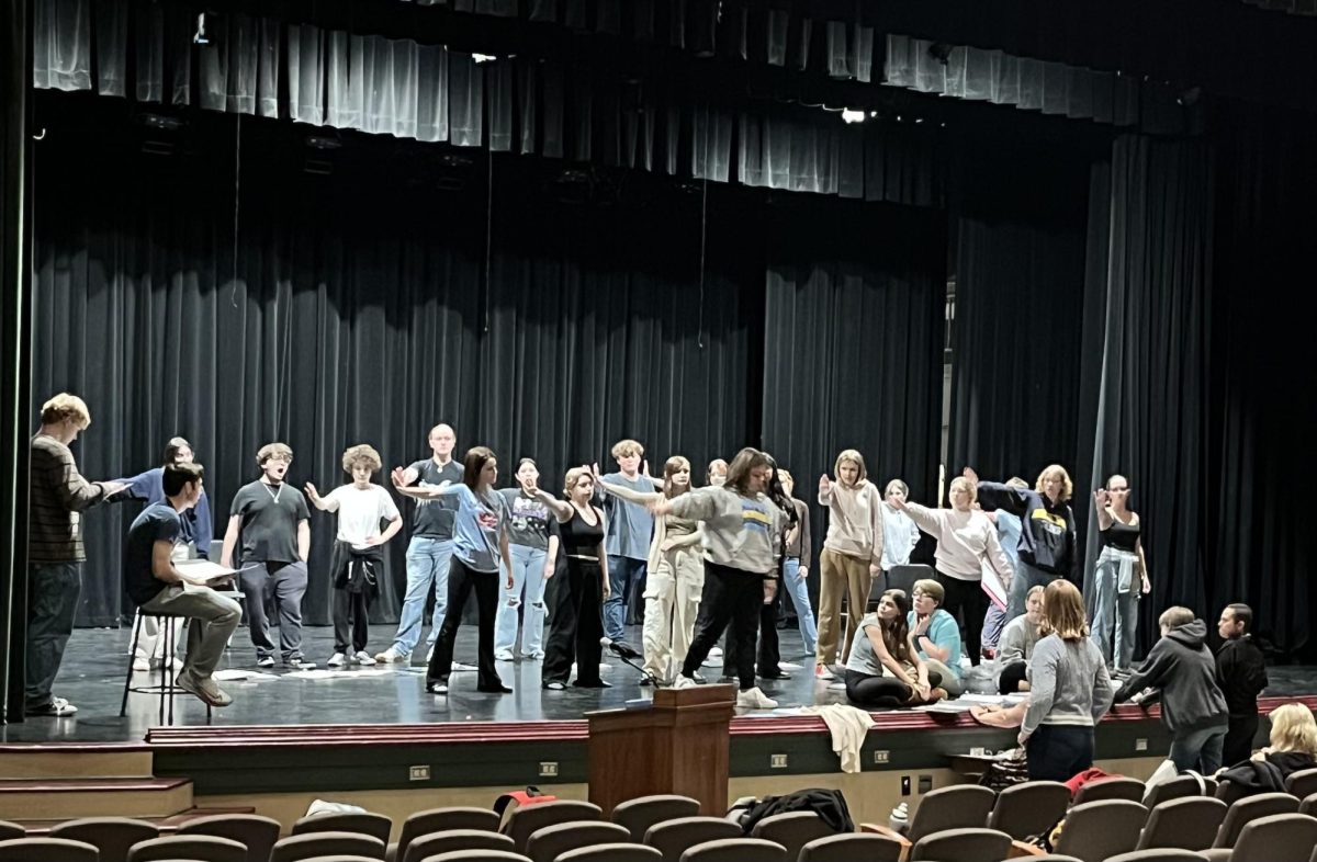 Moving and grooving. The cast learns the moves to the play. Not only will the cast be acting and singing, but they will be dancing along to the songs. 