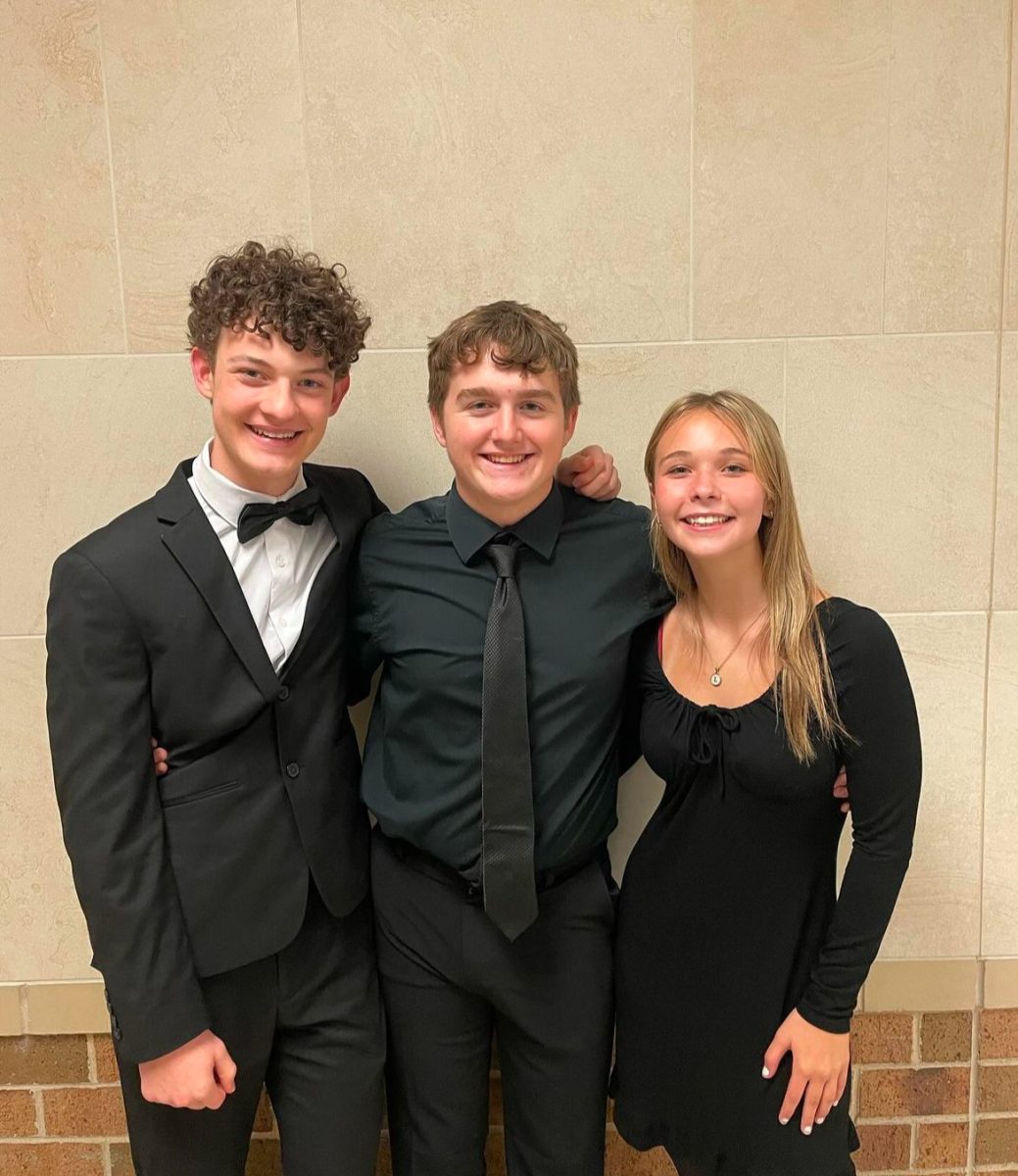 Fancy for finals. Orchestra Members senior Jack Stanek, sophomore Logan Olsen and sophomore Chloe Carmona are living out the final week of ILMEA, in Peoria, in style. “ILMEA is a way for us band kids to push our skills to the limit and meet talented musicians from Illinois,” Stanek said.