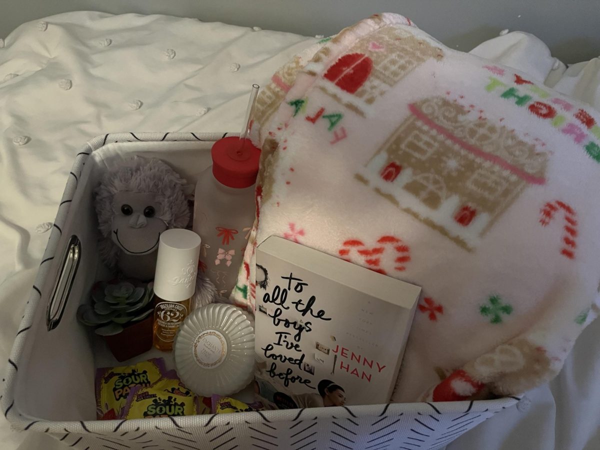 A burr basket made by Annabelle Threadgill showcasing the perfect items for a festive basket. 