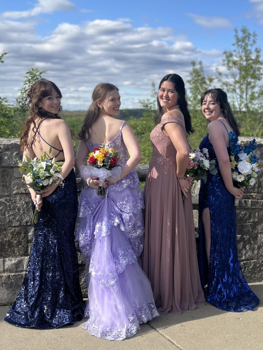 Left to Right. Mia Misener (12), Ava Wagner (12), Zulee Moreland (11), and Katelyn Gray (12) are pictured posing for their prom photos. 