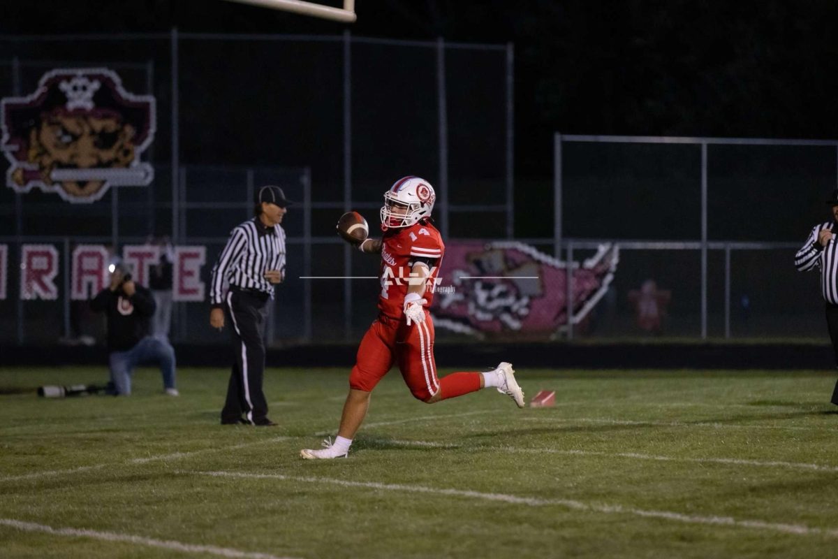 Touchdown Pirates! Senior Archer Cechowicz celebrates after scoring a touchdown. The Pirates won against Streator High School on September 5. Cechowicz said,” I like to win and score touchdowns.” 