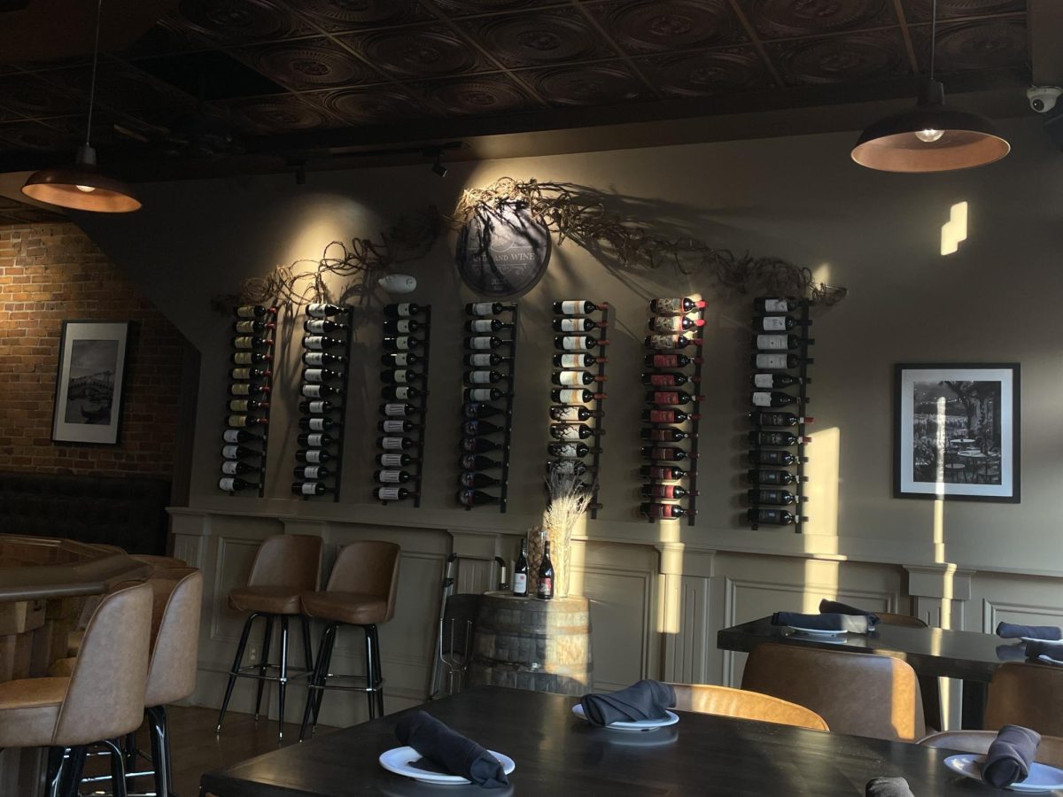 A look at an aesthetic wall inside Valentino's. "It's a cozy feeling inside of the restaurant and it's interesting seeing all the wine related items all over the place," sophomore Angel Munoz said.
