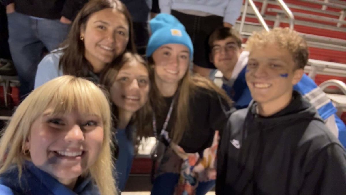 Students showing school spirit at the football teams' game against Granite City. From left to right- Junior Reese Purcell, Junior Audrina Banushi, Junior Ailey Harstad, Junior Ashlynn Ganiere, Freshman Bodie Martin and Senior Jules Verron-Dumazel. 
