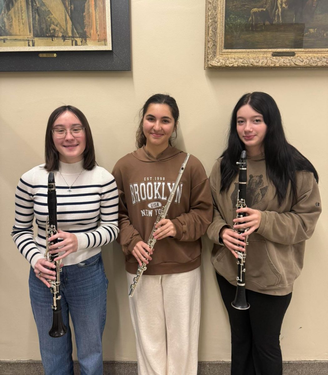 Polega (left) poses with the two other ILMEA All-State band students, junior Hallee Loza (center) and junior Olivia Power (right). All-State is a huge competition for high school bands statewide. 