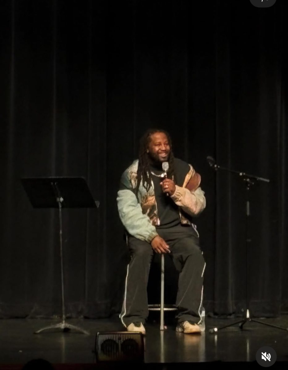 Motivational speaker Cameron Henderson speaks to the student body about embracing their passions.
