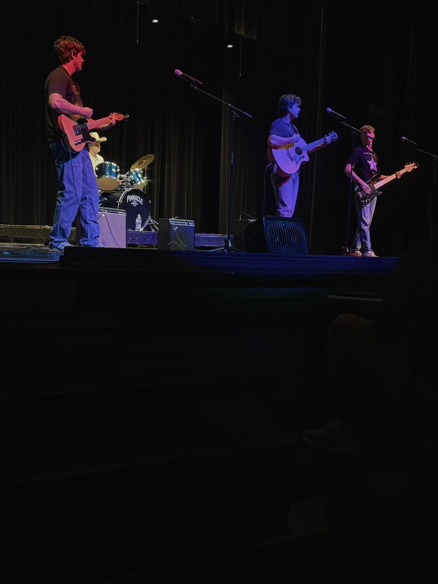 Juniors Eli Jeppson, Dane Schmitz, Rylee Hogue and Landon Brandt perform multiple songs during a student talent portion of Fine Arts.