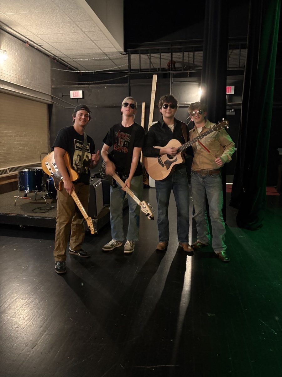 From left to right: juniors Eli Jeppson, Dane Schimtz, Landon Brandit and Rylee Hogue. 

Exit 97  backstage after their first live performance at fine arts.