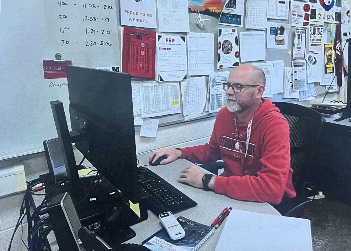 Kevin Olesen trying not to look "awkward" while getting a picture at his desk.