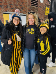 Gooo Hawkeyes. O’Fallon is at a Hawkeyes football game in Iowa. She ran into a student and her mom at the game. She said, “My beloved Iowa Hawkeye football game in September I ran into Zulee Moreland and her sweet mama Ratree!”    